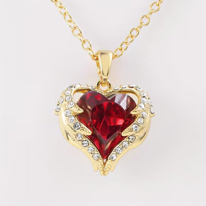 Collana con cuore di rubino Angel Embrace | Oro