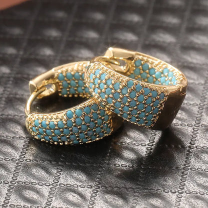 Orecchini a cerchio con perline color turchese e finitura dorata | Oro