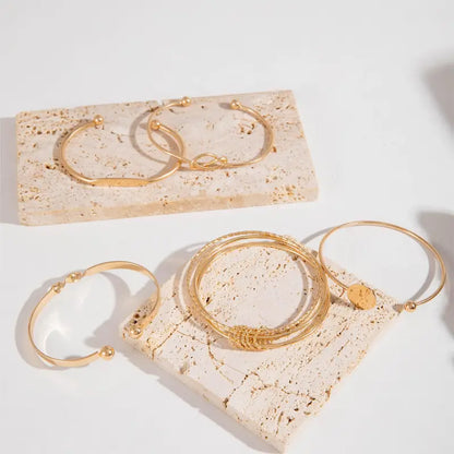 Set di bracciali Knotted Elegance | Oro