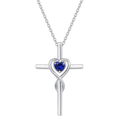 Collana con croce e pietra a forma di cuore zaffiro | Oro bianco