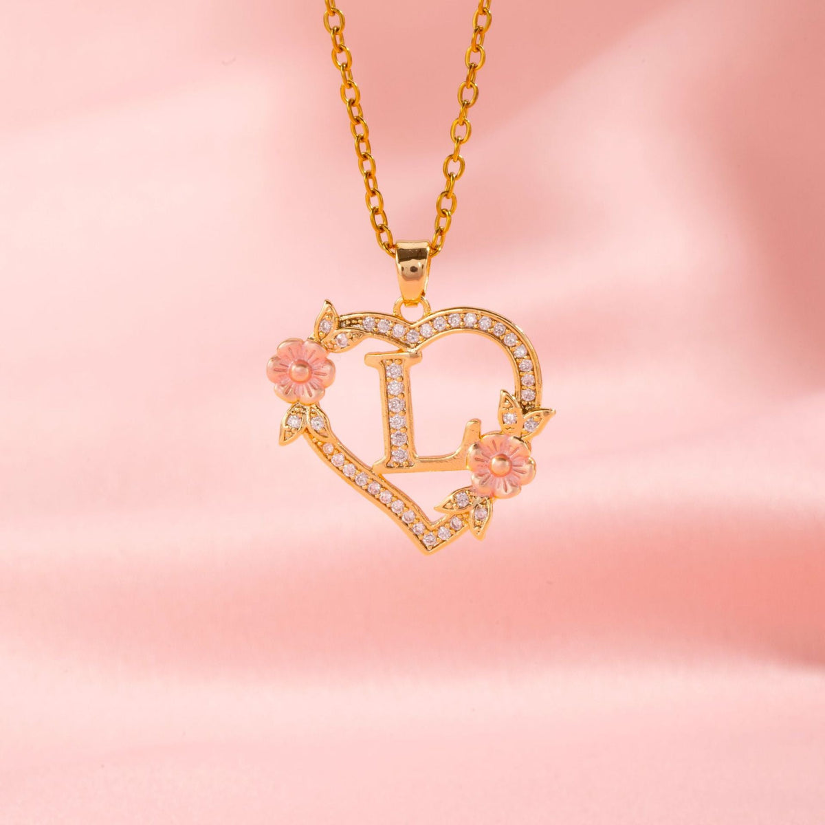 Collana con iniziale e charm floreale | Oro