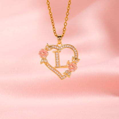 Collana con iniziale e charm floreale | Oro