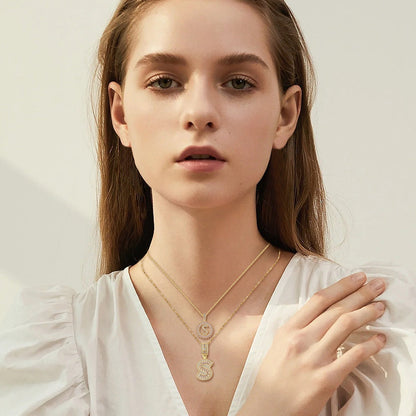 Set di collane con iniziale pavé | Oro