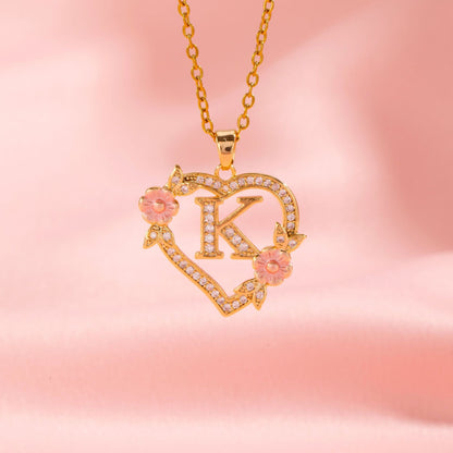 Collana con iniziale e charm floreale | Oro