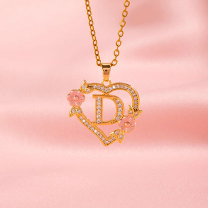 Collana con iniziale e charm floreale | Oro