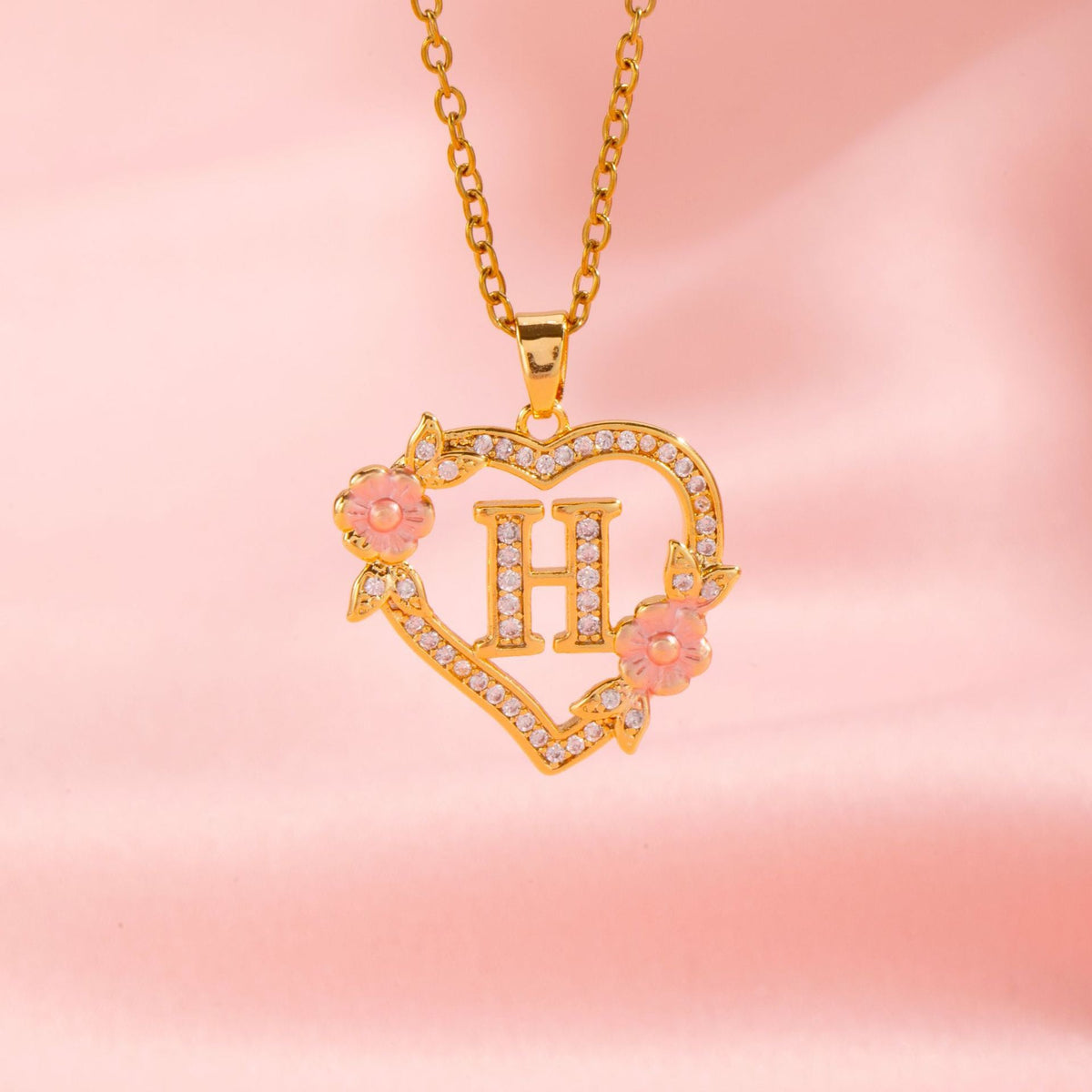 Collana con iniziale e charm floreale | Oro