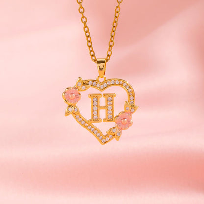 Collana con iniziale e charm floreale | Oro