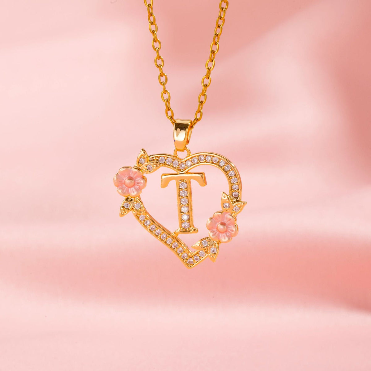 Collana con iniziale e charm floreale | Oro
