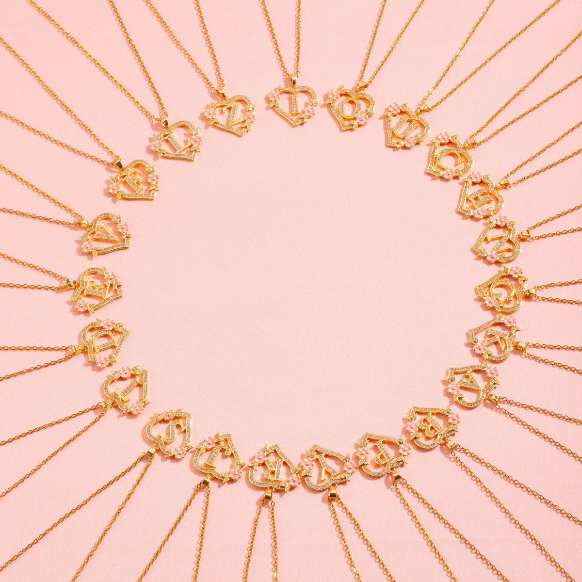 Collana con iniziale e charm floreale | Oro