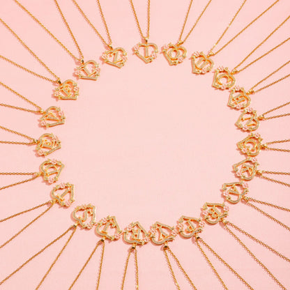 Collana con iniziale e charm floreale | Oro