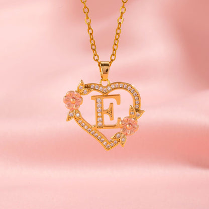 Collana con iniziale e charm floreale | Oro