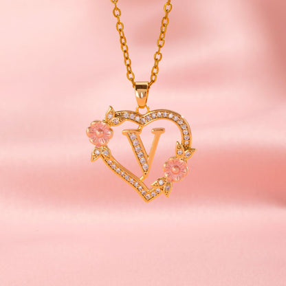 Collana con iniziale e charm floreale | Oro