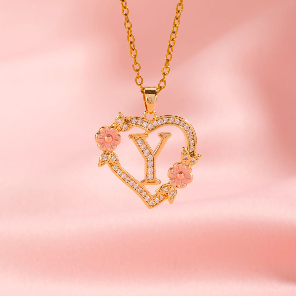 Collana con iniziale e charm floreale | Oro
