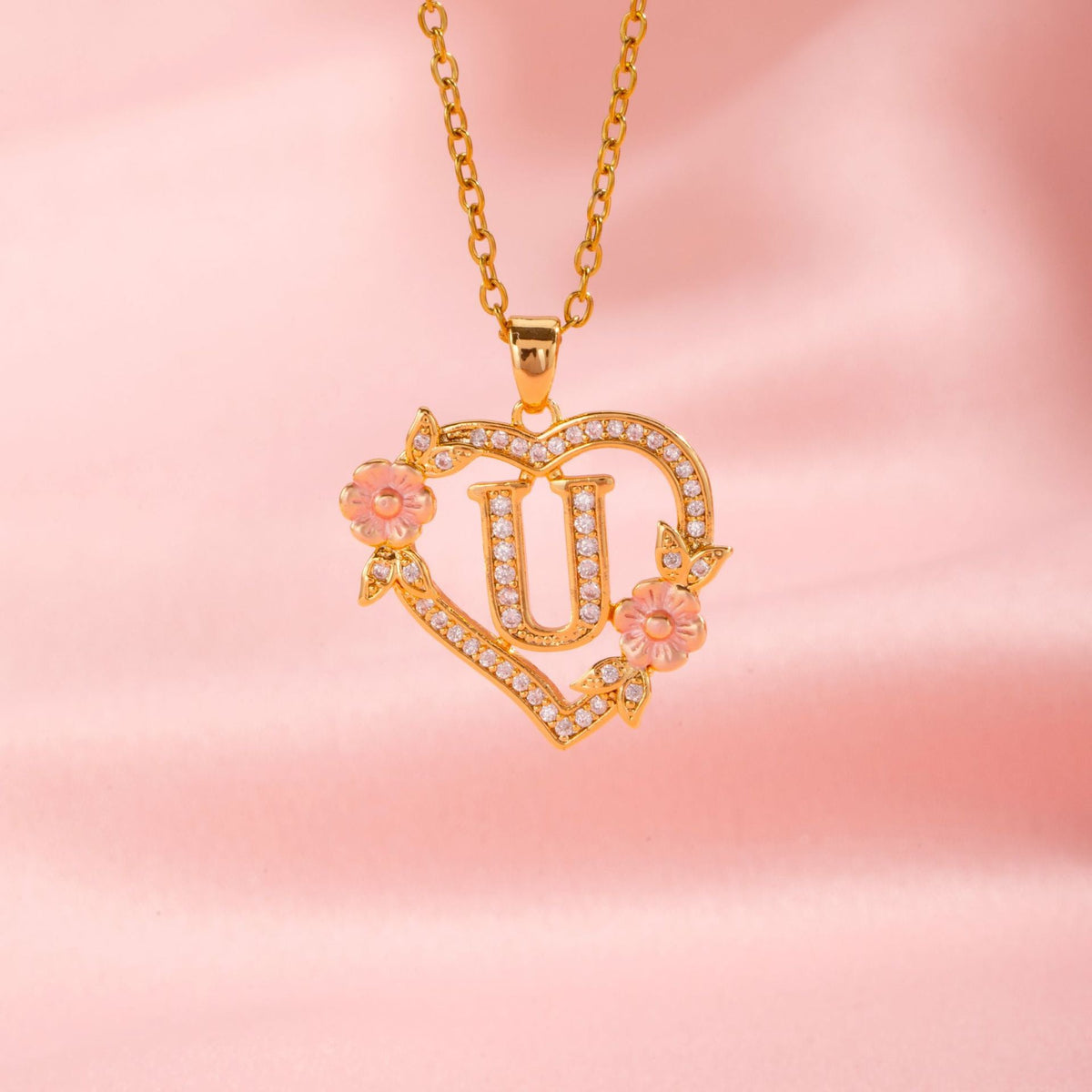 Collana con iniziale e charm floreale | Oro