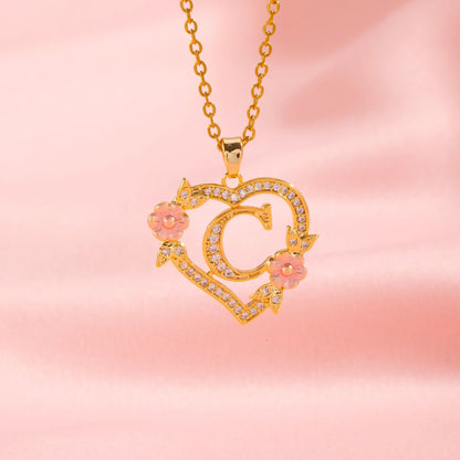 Collana con iniziale e charm floreale | Oro