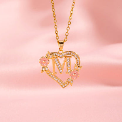 Collana con iniziale e charm floreale | Oro