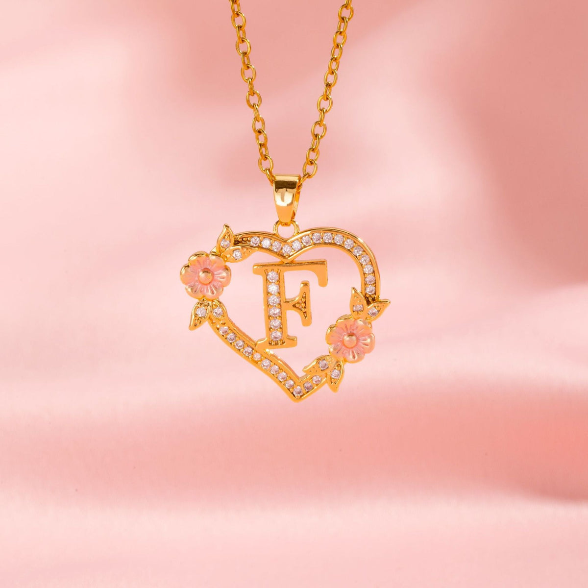 Collana con iniziale e charm floreale | Oro
