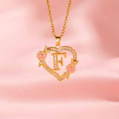 Collana con iniziale e charm floreale | Oro