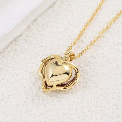 Collana con cuore di rubino Angel Embrace | Oro