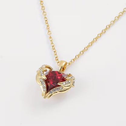 Collana con cuore di rubino Angel Embrace | Oro