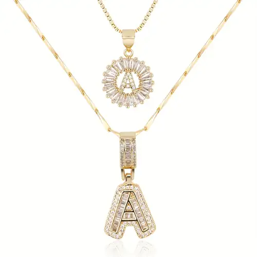 Set di collane con iniziale pavé | Oro