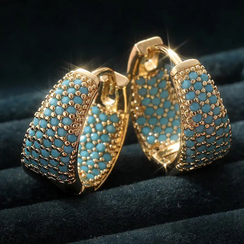 Orecchini a cerchio con perline color turchese e finitura dorata | Oro