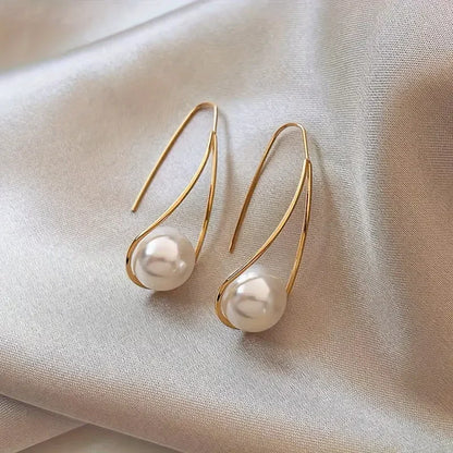 Eleganti orecchini pendenti con perle | Oro
