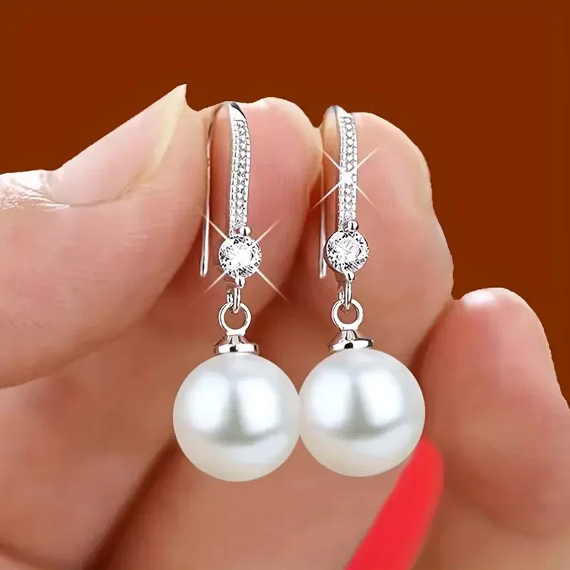 Orecchini a goccia con perle di zirconia lucenti | Oro bianco